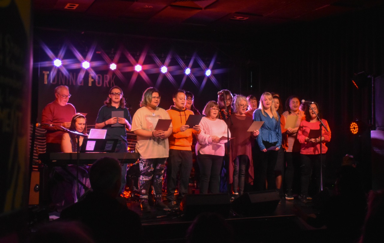 The We Are Loud community choir singing together